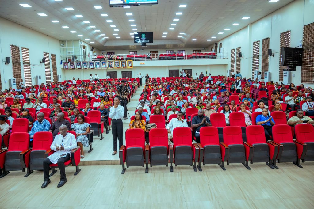 Large audience seated in an auditorium