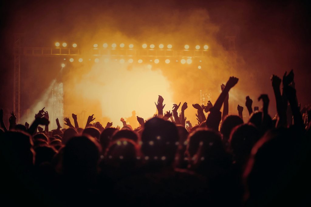 Band performing on stage in front of a crowd